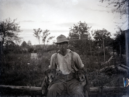 EED-51a Frederick G. Davis with two puppies. Note his farm overalls and suspenders 34 Nort