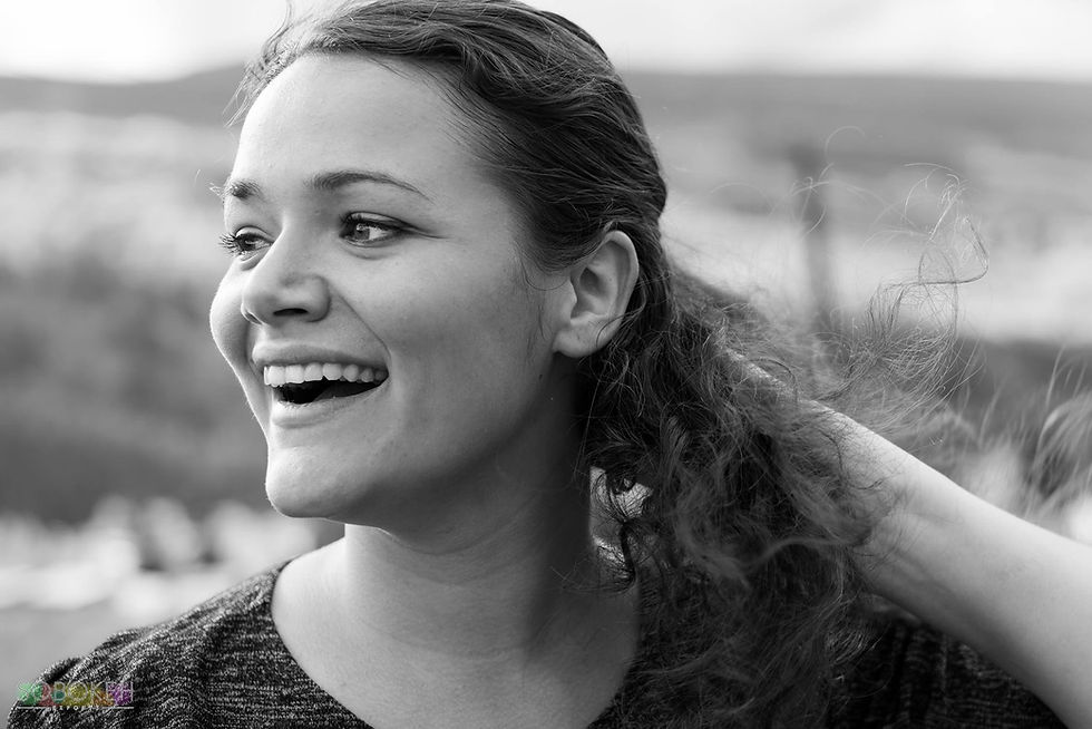 Candid photo of Kristina Rusch, adventure wedding photographer for Colorado and Hawaii destination weddings, natural and authentic wedding photography expert.