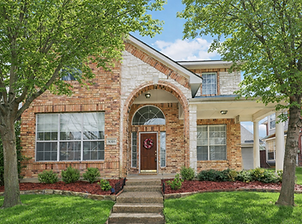 Front exterior of updated brick home at 8316 Charleston Drive in Valley Ranch, Irving TX featuring mature trees, manicured lawn, and welcoming entry.