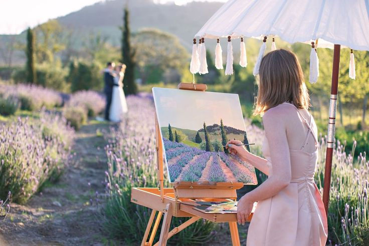 Woman painting lavender field under parasol, couple embracing in background. Serene outdoor setting with blooming lavender and soft hues.