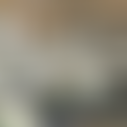 Opulent interior with white spiral staircase and elegant chandeliers. Marble fountain in foreground. Ceiling adorned with circular patterns.