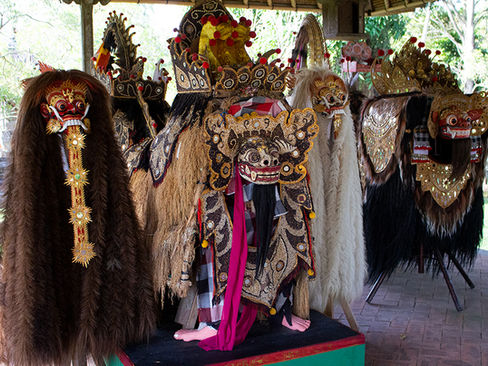 Traditional Barong and Rangda effigies arranged together, showing contrast between lion-like Barong and demonic Rangda