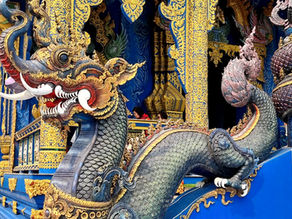 ornate dragon on the side of stairs, ornate gold carvings