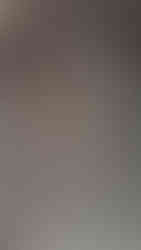 weathered Apsara relief at Angkor Wat, showing the dancer’s stylized pose and graceful carved movements