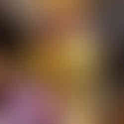 Golden Buddha statue with detailed patterns, surrounded by ornate carvings and hanging banners in a wooden temple setting. Peaceful mood.