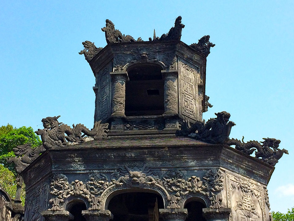 Elaborate stone structures, tiered terraces, and ornate dragon motifs define the unique architecture of Khai Dinh’s tomb
