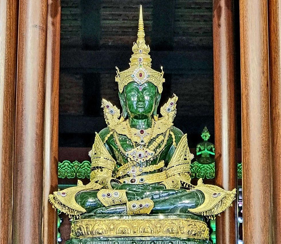 Emerald Buddha statue adorned with gold and jewels, seated in a wooden temple with intricate patterns, evoking a serene, regal atmosphere.