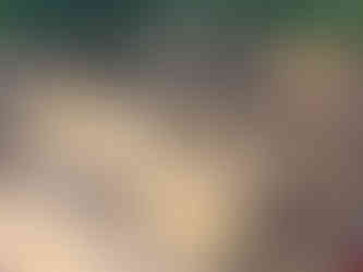 aerial view of the temple complex, looking down upon the ruins, tourists walking around