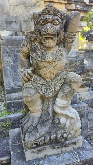 Stone statue of a mythical creature with ornate details, set against ancient stone ruins. Sunlit, weathered texture, and serene ambiance.