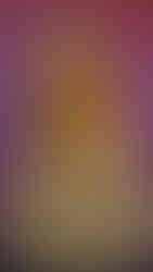 Golden Buddha statue with orange-yellow garland, set against a pink wall. The statue is in a meditative pose, conveying peace.