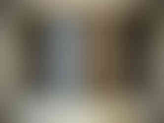 aged wooden shutters with eroded iron bars over them