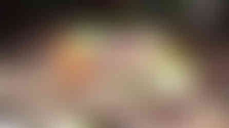 A woven bamboo basket full of colourful flowers