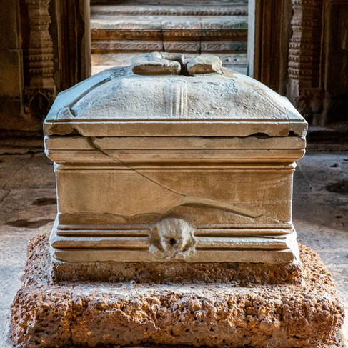Cracked stone box on square stone pedestal
