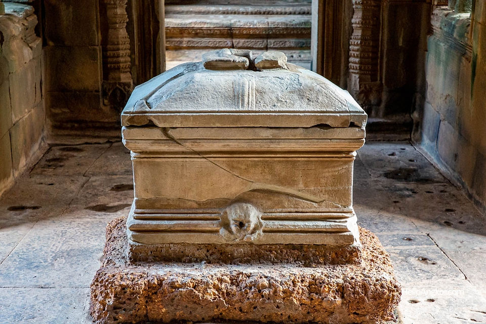 Cracked stone box on square stone pedestal
