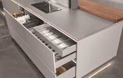 Multi-tier pull-out drawer system in stainless steel kitchen cabinet, Radiant Edge Design Singapore