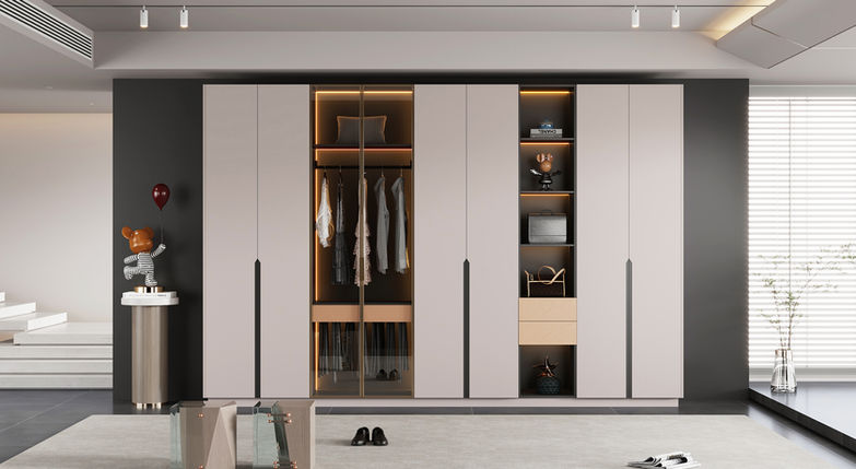 Form Series full-wall flat-door wardrobe in cream with recessed handles and internal LED lighting, custom stainless steel wardrobe by Radiant Edge Design Singapore