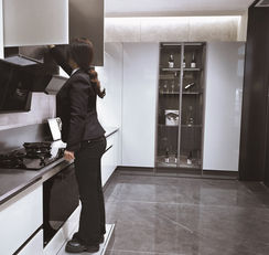 Completed stainless steel kitchen cabinet installation with dark finish doors, Radiant Edge Design Singapore