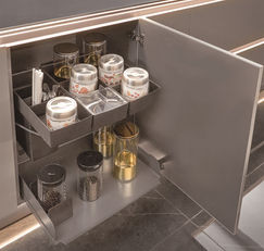 Pull-out spice and condiment organiser drawer in stainless steel kitchen cabinet, Radiant Edge Design