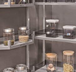 Corner carousel pull-out pantry organiser in stainless steel kitchen cabinet, Radiant Edge Design Singapore