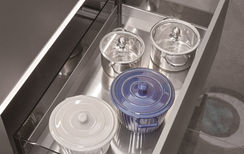 Deep pull-out container storage drawer in stainless steel kitchen cabinet, Radiant Edge Design Singapore