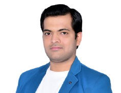 Portrait of a man in a blue blazer and white shirt on a plain white background, looking calmly at the camera