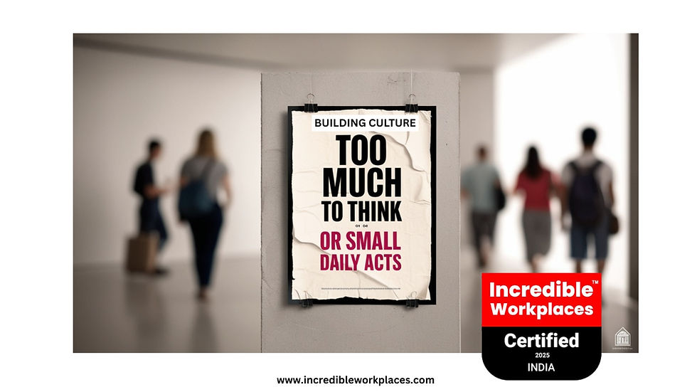 Blurry people walking past a sign saying "TOO MUCH TO THINK OR SMALL DAILY ACTS" in a hallway. Badge says "Incredible Workplaces Certified 2025 INDIA".