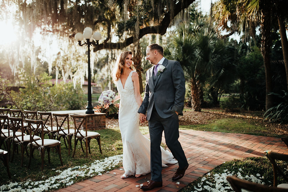 bride and groom walk down the aisle