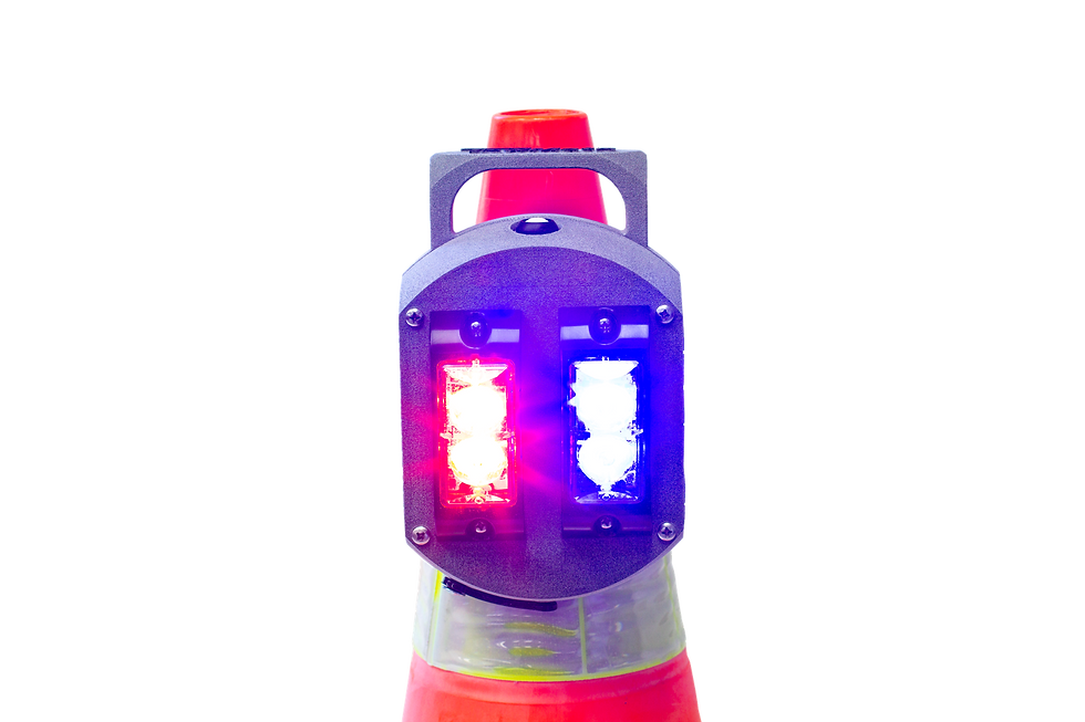Eye-level view of a roadside work zone with multiple TM-LS Lifesaver lights mounted on cones