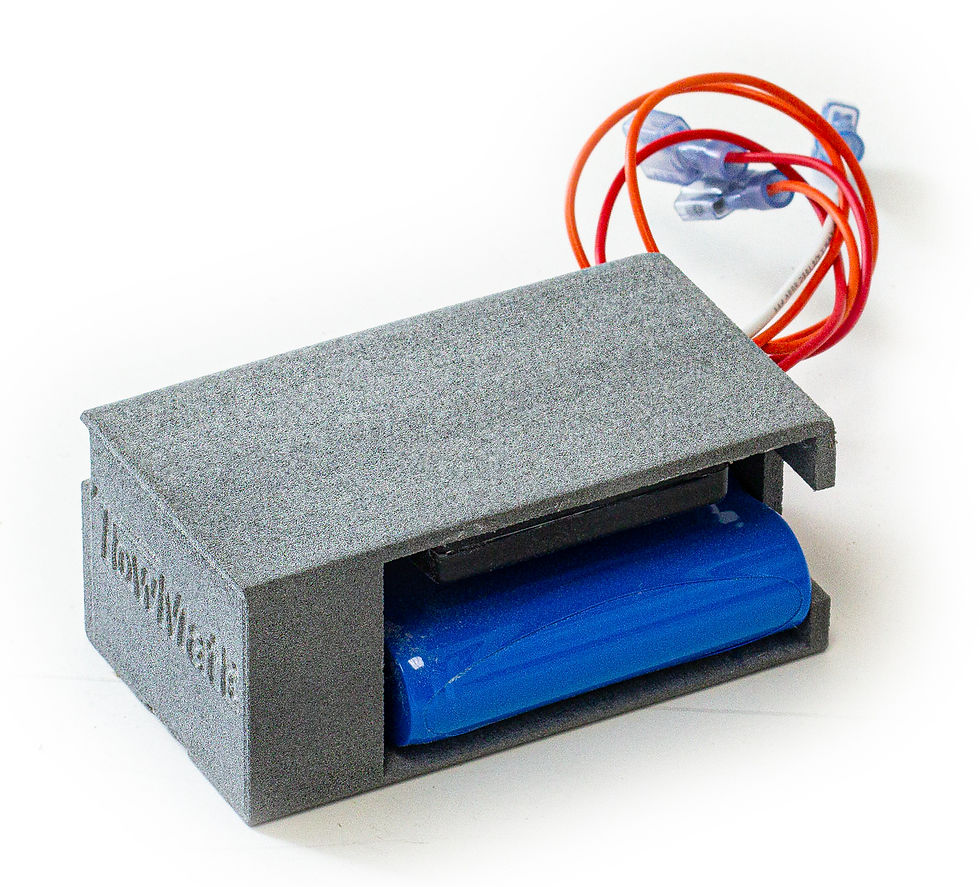 Eye-level view of a wireless tow light charging on a portable lithium-ion battery charger