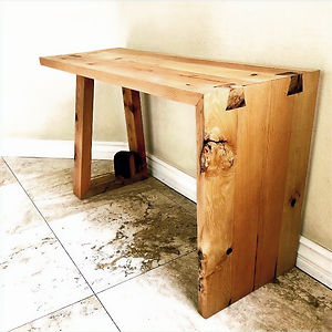 a reclaimed pine bench made from railroad ties