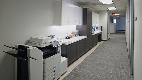 Common work areas are contained centrally on the floor to accommodate team members.
