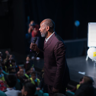 man with photographer behind him