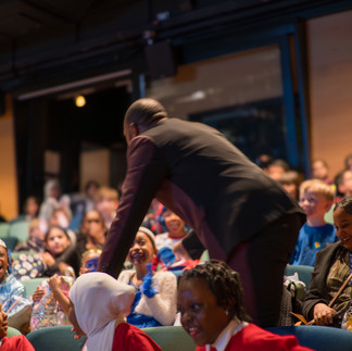 children laughing in theatre