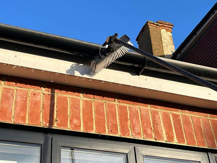 Cleaning house gutters.jpeg