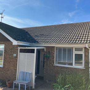 Clean fascias and gutters on bungalow