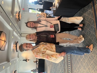 Jennifer Sadera with two readers at Author Expo book event