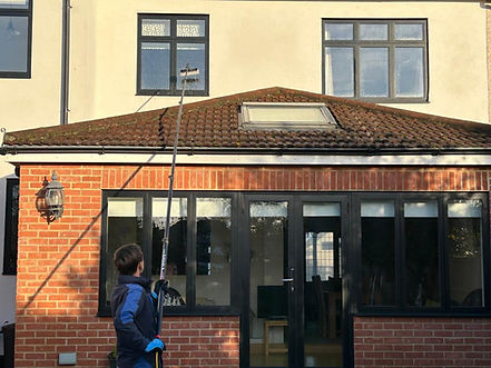 Reaching to high windows for window cleaning.jpeg