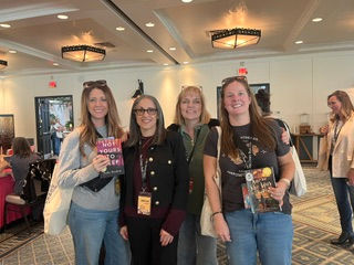 Jennifer Sadera with readers at a book event Author Expo