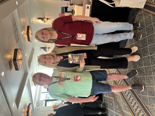 Jennifer Sadera with a couple at Creepy Retreat