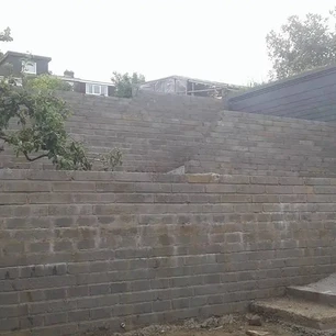 Block and brick work built retaining wall for stepped g
