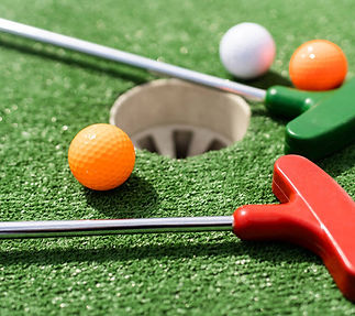 stock-photo-close-miniature-golf-hole-bat-ball.jpg