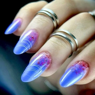 blue gel extensions with encapsulated flowers created for live masterclass