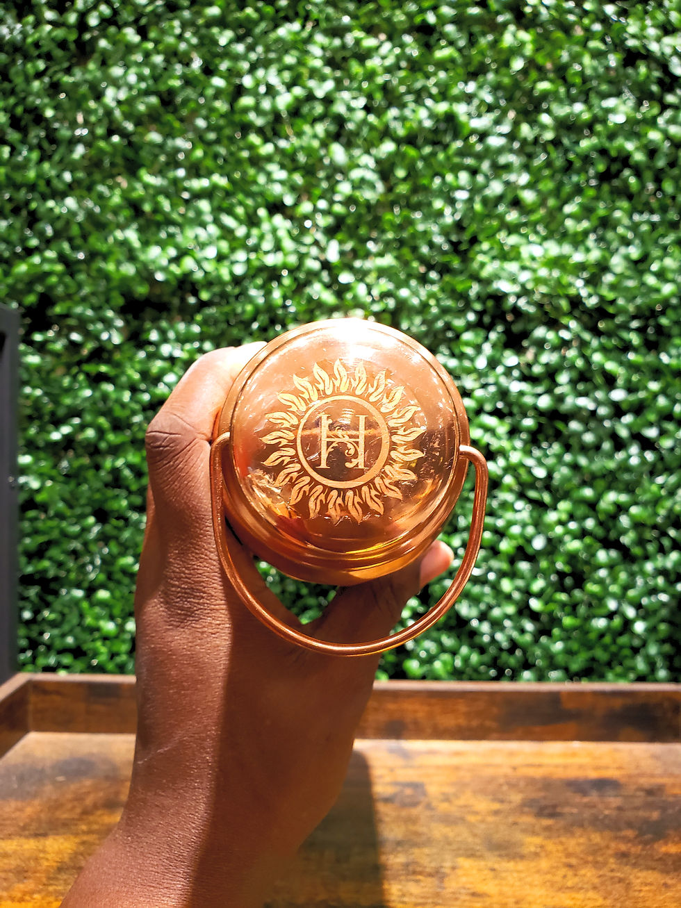 Herbetarian's logo on copper bottle top