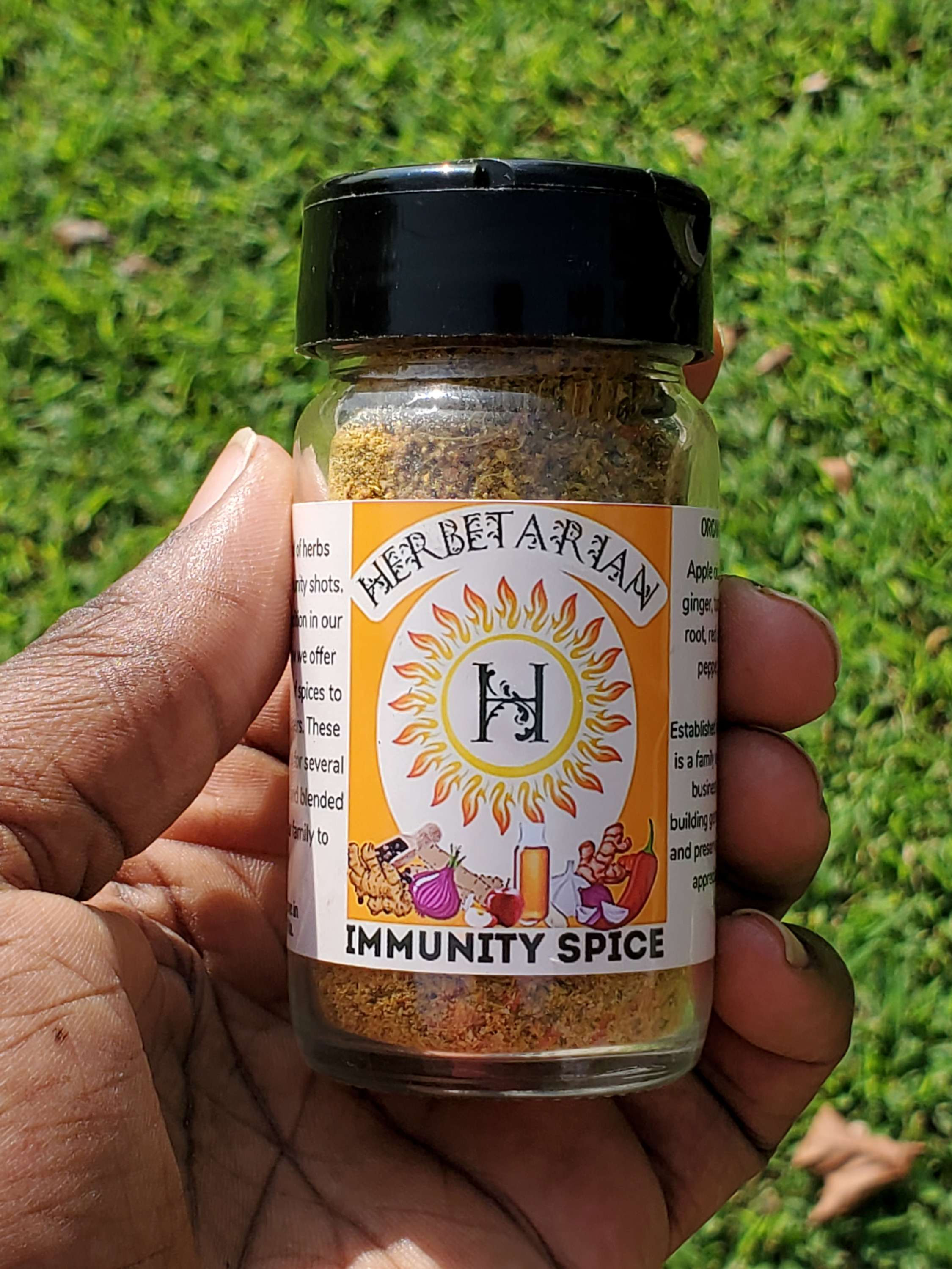Herbetarian's Immunity Spice 1oz bottle in a hand