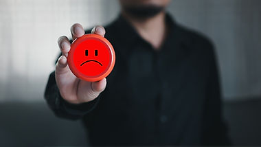 A dissatisfied customer symbolising the importance of timely complaint handling and escalation management in maintaining trust.