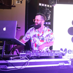 DJ Winston T at his setup mixing music