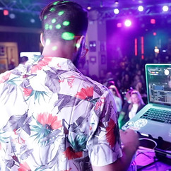 DJ Winston T's back and dj setup in purple lighting