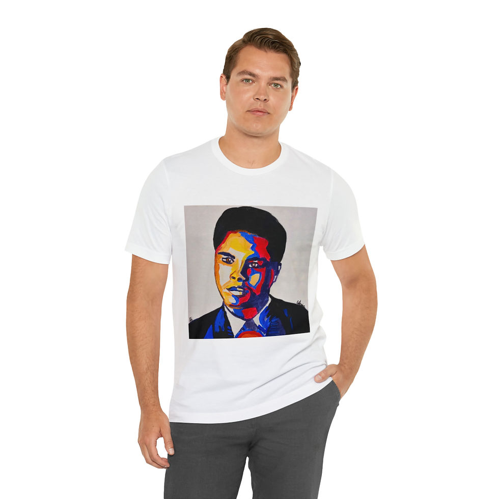 Thumbnail: A white t-shirt featuring a bold and colorful portrait of Muhammad Ali. The artwork showcases Ali in a striking, pop-art style with vibrant shades of blue, red, and orange. The product is titled 'Float Like a Butterfly - Muhammad Ali T-Shirt.