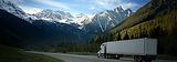 Truck driving along mountain road.jpg