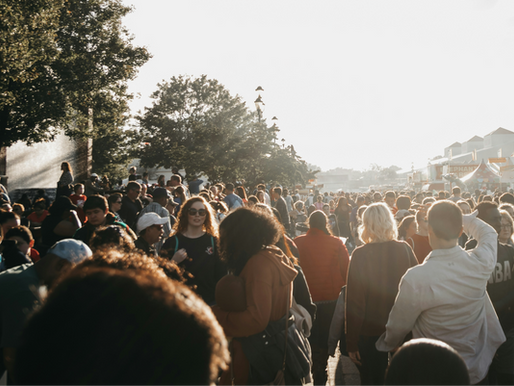 Large crowd outdoors at community event